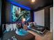 A themed bedroom features space decorations, two twin beds, and unique lighting at 1810 Caribbean View Ter, Kissimmee, FL 34747