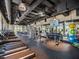 Spacious fitness center featuring modern equipment, rubber flooring, exposed ductwork, and large windows at 1810 Caribbean View Ter, Kissimmee, FL 34747