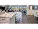 Modern eat-in kitchen featuring a large island with bar stools and an open-concept design at 1810 Caribbean View Ter, Kissimmee, FL 34747