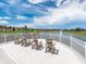 Serene lake view with lounge chairs providing a tranquil outdoor space for relaxation at 1810 Caribbean View Ter, Kissimmee, FL 34747