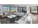 Expansive living room with a comfortable sectional sofa and a view of the outdoor patio at 1810 Caribbean View Ter, Kissimmee, FL 34747