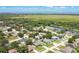 Aerial view of a residential neighborhood featuring single-Gathering homes near a marsh and lake at 1822 Ashton E Dr, St Cloud, FL 34771