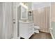 A quaint bathroom featuring a modern vanity with a marble countertop at 1822 Ashton E Dr, St Cloud, FL 34771