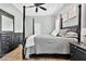 A luxurious bedroom with a four-poster bed and dark wood furniture at 1822 Ashton E Dr, St Cloud, FL 34771