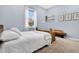 A cozy bedroom with a full size bed, white bedding, and decor at 1822 Ashton E Dr, St Cloud, FL 34771