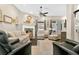 Beautifully decorated living room featuring wood floors, a fireplace and large windows, making it a warm and inviting space at 1822 Ashton E Dr, St Cloud, FL 34771