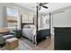 Cozy bedroom featuring a four-poster bed, soothing color scheme, and ample natural light creating a tranquil retreat at 1822 Ashton E Dr, St Cloud, FL 34771