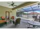 Patio with outdoor seating and a view of the screened pool area at 1822 Ashton E Dr, St Cloud, FL 34771