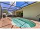 Pool featuring a screened enclosure with an outdoor kitchen at 1822 Ashton E Dr, St Cloud, FL 34771