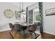 Elegant dining room with modern lighting, seating for six, and easy access to the outdoor patio at 1856 Castleton Dr, St Cloud, FL 34771