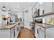 Well-equipped kitchen featuring stainless steel appliances, granite countertops, and ample cabinet space at 1856 Castleton Dr, St Cloud, FL 34771
