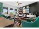 Bright living room featuring modern decor, comfortable seating, and a sleek entertainment center at 1856 Castleton Dr, St Cloud, FL 34771