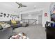 Large and inviting living room with plush seating and carpeting, providing a welcoming and stylish space for relaxation and entertainment at 1856 Castleton Dr, St Cloud, FL 34771
