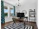 Bright, modern office with stylish desk, natural light, and chic decor creates an inspiring and productive workspace at 1856 Castleton Dr, St Cloud, FL 34771
