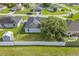 Aerial view of a large fenced backyard with mature trees and storage shed at 1913 Manatee Ct, Kissimmee, FL 34759