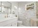 Elegant bathroom featuring modern fixtures, textured walls, and a bright window at 1913 Manatee Ct, Kissimmee, FL 34759