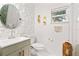 Stylish bathroom featuring decorative wall art, modern sink, and unique fixtures at 1913 Manatee Ct, Kissimmee, FL 34759