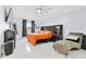 Spacious bedroom with a ceiling fan and large window for natural light at 1913 Manatee Ct, Kissimmee, FL 34759