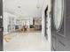 Bright foyer with marble floors, pendant lighting, and an open view into the dining and kitchen areas at 1913 Manatee Ct, Kissimmee, FL 34759