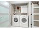 Convenient laundry room equipped with modern appliances and ample storage space at 1913 Manatee Ct, Kissimmee, FL 34759