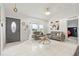 Inviting living room with comfortable seating, modern decor, and large bay windows for natural light at 1913 Manatee Ct, Kissimmee, FL 34759