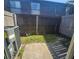 Cozy fenced backyard with a concrete patio at 1920 Conway Rd # 4, Orlando, FL 32812