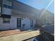 Townhouse exterior features well-maintained stucco, covered entries and tidy brick and concrete walkways at 1920 Conway Rd # 4, Orlando, FL 32812
