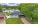 Aerial shot of the home showcasing its mature trees, roof, and landscaping at 2 S Lavon Ave, Kissimmee, FL 34741