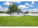 Wide view of a sprawling, fenced backyard with lush green grass at 2 S Lavon Ave, Kissimmee, FL 34741