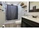 Updated bathroom featuring a tiled shower, modern vanity, stylish fixtures and beautiful decorative elements at 2 S Lavon Ave, Kissimmee, FL 34741