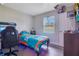 The light-filled bedroom offers a comfortable space with modern decor and ample room to relax and recharge at 2 S Lavon Ave, Kissimmee, FL 34741