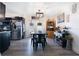 The dining area showcases an elegant light fixture, complemented by stainless steel appliances in the adjacent kitchen at 2 S Lavon Ave, Kissimmee, FL 34741