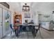 Inviting dining room features stylish decor, modern lighting, and seamless access to the living area and outdoor patio at 2 S Lavon Ave, Kissimmee, FL 34741