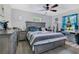 Calming main bedroom with serene decor, a ceiling fan and an abundance of natural light at 2 S Lavon Ave, Kissimmee, FL 34741