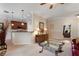 A spacious living area that opens to the kitchen featuring tile floors and contemporary furnishings at 214 Verona Dr, Kissimmee, FL 34759