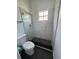 Modern bathroom with a glass-enclosed shower featuring marble-style tiles and a sleek, dark shower floor at 2356 Chadwick Cir, Kissimmee, FL 34746