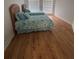 Bright bedroom with two twin beds, wood floors, neutral walls, and window at 2356 Chadwick Cir, Kissimmee, FL 34746