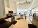 Bright kitchen with stainless steel appliances and a view of the living area offers a seamless blend of style and functionality at 2356 Chadwick Cir, Kissimmee, FL 34746