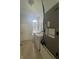 Bright laundry room featuring a washer, dryer, and Carrier AC unit, enhanced by natural light from a window at 2356 Chadwick Cir, Kissimmee, FL 34746