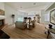 Bright and airy living room with a fireplace, hardwood floors, and large windows overlooking the pool at 2356 Chadwick Cir, Kissimmee, FL 34746