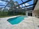 A pristine screened-in pool with an expansive patio deck creates an ideal space for entertaining and enjoying the outdoors at 2356 Chadwick Cir, Kissimmee, FL 34746