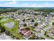Aerial view of a charming home, with a swimming pool, in a friendly residential neighborhood near a pond at 2561 Montego Bay Blvd, Kissimmee, FL 34746