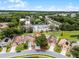 Aerial view of charming home on a cul-de-sac with large trees and convenient access to amenities at 2561 Montego Bay Blvd, Kissimmee, FL 34746