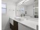 Contemporary bathroom with a white countertop, vessel sink, modern fixtures, and large mirror at 2561 Montego Bay Blvd, Kissimmee, FL 34746
