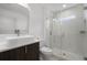Modern bathroom featuring a vessel sink, wood cabinet, and walk-in shower with elegant tile work at 2561 Montego Bay Blvd, Kissimmee, FL 34746