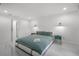 Clean bedroom with a king bed and ensuite bathroom featuring a modern, minimalist design at 2561 Montego Bay Blvd, Kissimmee, FL 34746