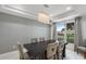 Stunning dining room with a modern chandelier and large window at 2561 Montego Bay Blvd, Kissimmee, FL 34746