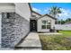 Home featuring a clean front entrance and modern stone accents at 2561 Montego Bay Blvd, Kissimmee, FL 34746