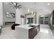 Spacious open-plan kitchen and living area with island, fireplace, and lots of natural light at 2561 Montego Bay Blvd, Kissimmee, FL 34746