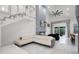 Bright, open living space featuring a cozy fireplace and modern staircase at 2561 Montego Bay Blvd, Kissimmee, FL 34746